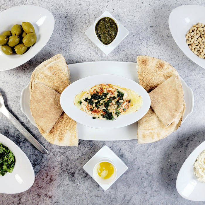 Image of Turkish-Style Hummus with Feta Cheese Toasted Pine Nuts and Marinated Olives