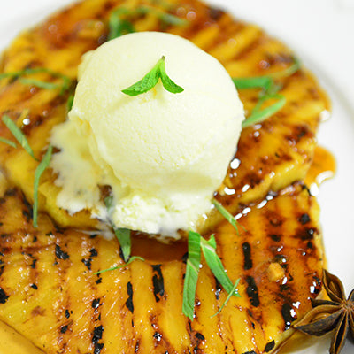 Image of Grilled Pineapple with Rum, Lime-Ginger, and Ice Cream