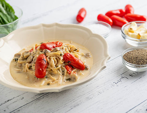 Image of Hearts of Palm Pasta Alfredo with Tomato, Mushroom & Basil