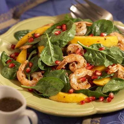 Image of Spinach Salad with Spicy Grilled Shrimp and Pomegranate Seeds