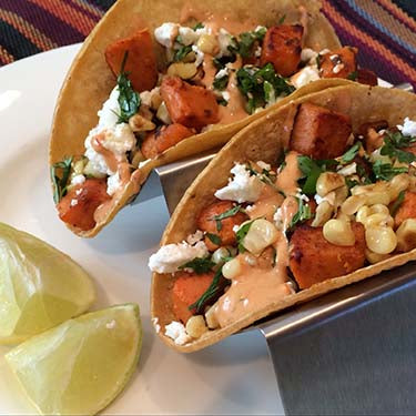 Image of Vegetarian Roasted Corn and Sweet Potato Tacos with Feta Cheese and Honey Lime Chipotle Cream