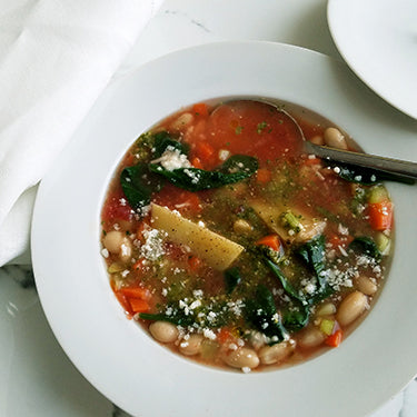 Image of Fresh Vegetable Soup with Basil Pesto and Pecorino Romano Cheese