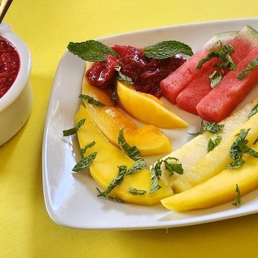 Image of Tropical Fruit Spears with Berry-Orange Sauce
