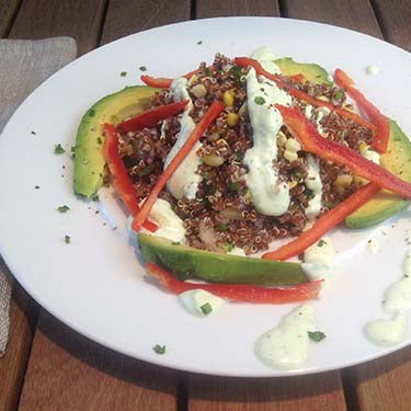 Image of Red Quinoa Salad with Roasted Chilies, Green Tomatoes and Fresh Corn in a Creamy Meyer Lemon and Chive Dressing