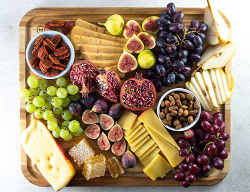 Image of charcuterie platter with cheese, grapes, nuts and pears