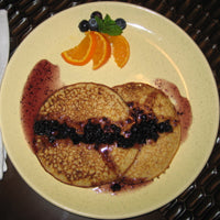Image of Golden Flaxjacks with Warm Blueberry Syrup