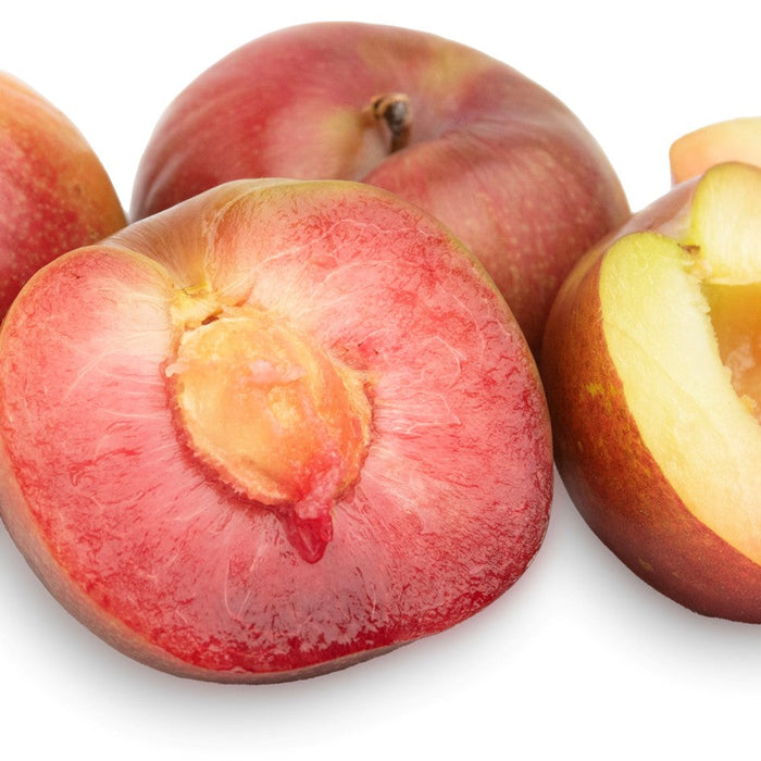 Organic Plums from Melissa's in white background