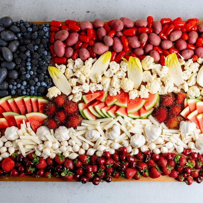 Red, white, and red produce arraged to form a United States Flag