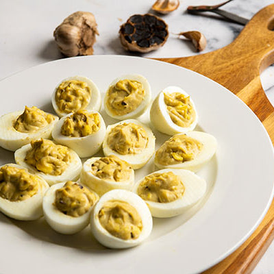 Image of Deviled Eggs with Black Garlic