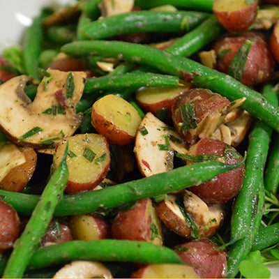 Image of Dutch Red Potato and Green Bean Salad on Microgreens