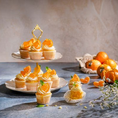 Easy Pixie tangerine mini cupcakes from Melissa’s, a bright and colorful bite-sized dessert with citrusy appeal