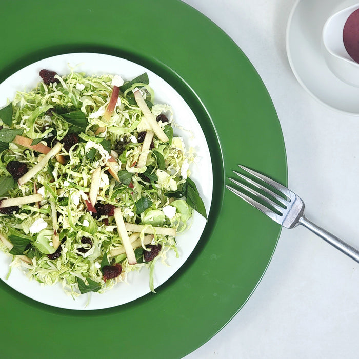 Image of Shaved Brussels Sprouts, Goat Cheese, and Toasted Pine Nut Salad with Cranberry Vinaigrette