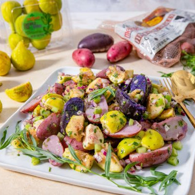 Fresh Fingerling Potato, Fig and Tarragon Salad served on a white platter