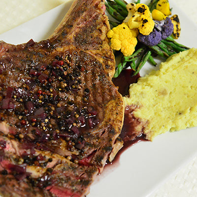Image of Grilled Bone-In Rib Eye Steaks with Red Wine Peppercorn Sauce, DYP’s and Baby Vegetables