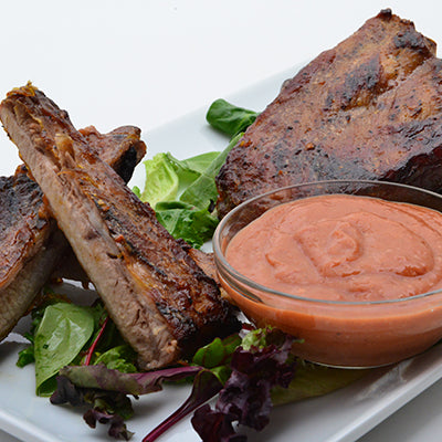 Image of Grilled Rack of Ribs with Cactus Pear-Mango BBQ Sauce