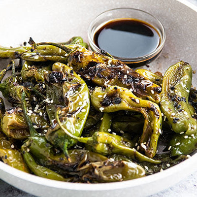 Image of grilled shishito peppers