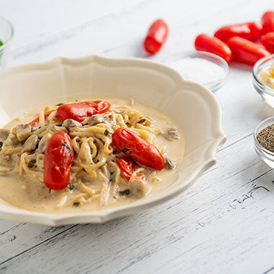 Image of Hearts of Palm Pasta Alfredo with Tomato, Mushroom & Basil