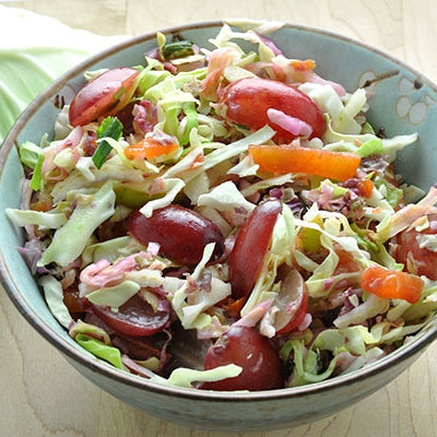 Image of Cabbage Slaw with Butterscotch™ Pears, Persimmon, Radish & Christmas Crunch® Grapes
