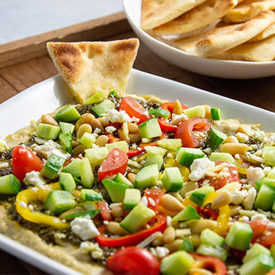 Image of Layered Hatch Chile Hummus Dip with Toasted Pita Chips