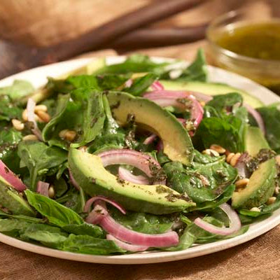 Image of Organic Spinach Salad with Basil Vinaigrette and Avocado Garnish