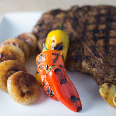 Image of Grilled Porterhouse Steaks with Caramelized Cipolline Onions, Grilled Veggie Sweets and Grilled DYPs 