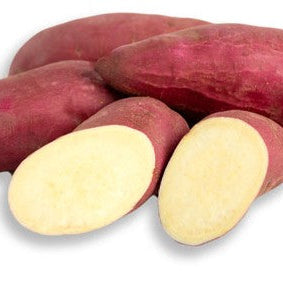 garnet sweet potatoes whole and sliced on a white background