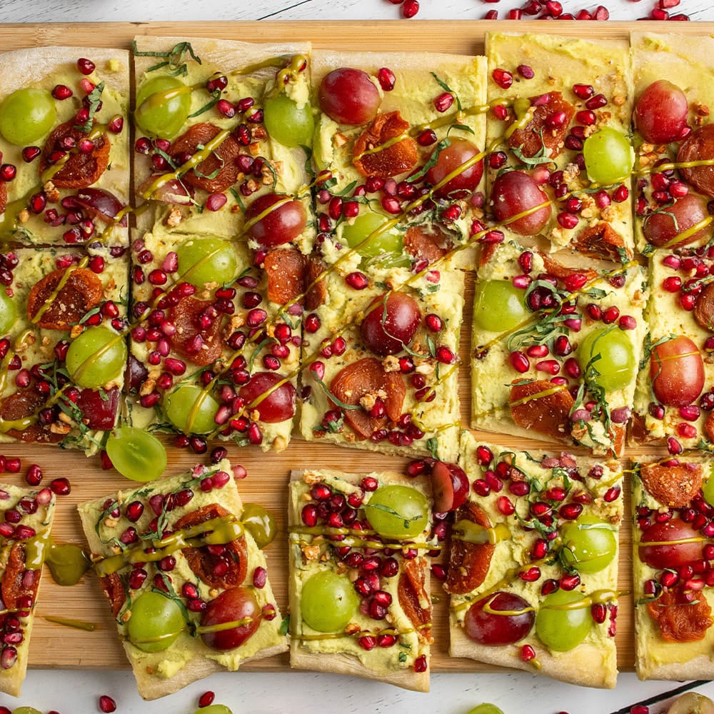 fruit pizza on a cutting board