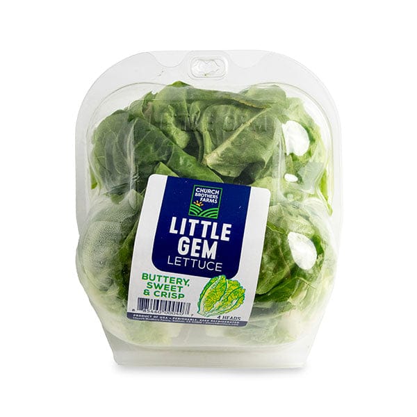 Little Gem Lettuce on a white surface.